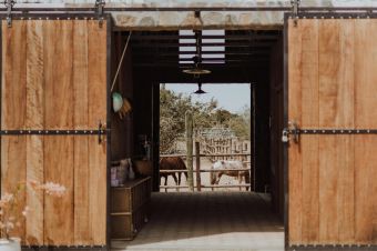 Explore the charm of a wooden barn entrance in San Juan del Rancho, Mexico.