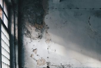 Explore the rustic charm of an abandoned room with worn furniture and scattered debris in Sankt-Peterburg.